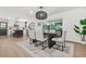 Bright dining area features a pendant light fixture and seamless transition to the kitchen and living room at 3337 Toney Dr, Decatur, GA 30032