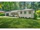 Beautiful brick home with a well-maintained lawn, carport, and stylish, modern windows at 3337 Toney Dr, Decatur, GA 30032
