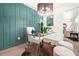 Bright home office featuring a clear desk and decorative teal accent wall at 3337 Toney Dr, Decatur, GA 30032