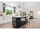 Spacious kitchen featuring a center island with seating, stainless appliances, and an adjacent dining area at 3337 Toney Dr, Decatur, GA 30032