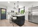 Modern kitchen features stainless appliances, shaker cabinets, subway tile backsplash, and center island with seating at 3337 Toney Dr, Decatur, GA 30032