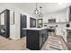 Modern kitchen featuring stainless steel appliances, an island, and a tile backsplash at 3337 Toney Dr, Decatur, GA 30032