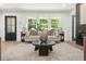 Well-lit living room with large windows, contemporary furniture, and modern decor at 3337 Toney Dr, Decatur, GA 30032