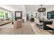 Stylish living room with a fireplace, open layout, and dining area at 3337 Toney Dr, Decatur, GA 30032