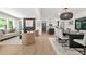 Open-concept living area with modern decor seamlessly connects the living room, dining, and kitchen at 3337 Toney Dr, Decatur, GA 30032
