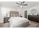 Bright main bedroom features a ceiling fan, neutral decor, two bedside tables, and a dresser at 3337 Toney Dr, Decatur, GA 30032