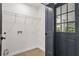 A functional mud room with a wire shelf and easy access to the outside at 3337 Toney Dr, Decatur, GA 30032