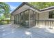 Exterior view of the screened-in back porch, with wood decking and outdoor seating area at 3337 Toney Dr, Decatur, GA 30032