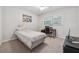 Neutral-colored bedroom featuring a twin bed, desk, and carpeted floors at 461 Village Green Sw Ct, Lilburn, GA 30047