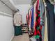Spacious walk-in closet with organized shelves and hanging storage at 461 Village Green Sw Ct, Lilburn, GA 30047