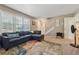 View of a living room with ample natural light and access to staircase at 461 Village Green Sw Ct, Lilburn, GA 30047