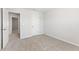 Bright bedroom with a doorway view into other rooms; also shows closet and window with blinds at 7205 Brushwood Bend (Lot 31), Lithonia, GA 30058