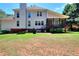 Spacious backyard with a screened-in porch and mature trees at 781 Templeton Dr, Loganville, GA 30052