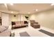 Finished basement featuring ample seating, neutral walls, and carpet, perfect for a recreation area at 781 Templeton Dr, Loganville, GA 30052
