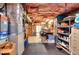 Spacious basement with open layout, workshop area, storage shelves, and rubber flooring, ideal for various purposes at 781 Templeton Dr, Loganville, GA 30052