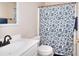 Cozy bathroom featuring patterned shower curtain and dark fixtures at 781 Templeton Dr, Loganville, GA 30052