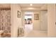 Neutral bathroom featuring a toilet, sink, decorative shower curtain, and tile flooring for a serene atmosphere at 781 Templeton Dr, Loganville, GA 30052