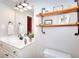 Bathroom with modern vanity, decorative shelves, and stylish lighting at 781 Templeton Dr, Loganville, GA 30052