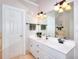 Bathroom featuring double sinks, granite countertops, and modern fixtures at 781 Templeton Dr, Loganville, GA 30052