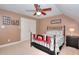 Inviting bedroom with ceiling fan, comfortable bed, and neutral color scheme at 781 Templeton Dr, Loganville, GA 30052