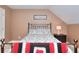 Bright bedroom with a bed, nightstand, and art on the wall at 781 Templeton Dr, Loganville, GA 30052