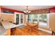 Bright dining area with wainscoting, chandelier, and access to the porch at 781 Templeton Dr, Loganville, GA 30052