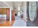 Inviting entryway with hardwood floors and view into the living area at 781 Templeton Dr, Loganville, GA 30052