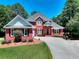 Charming brick home with well-manicured lawn and curved driveway at 781 Templeton Dr, Loganville, GA 30052