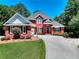Charming brick home with well-manicured lawn and curved driveway at 781 Templeton Dr, Loganville, GA 30052