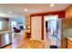 Open kitchen with a view into a living room with a fireplace at 781 Templeton Dr, Loganville, GA 30052