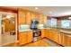 Kitchen with stainless steel appliances and yellow walls at 781 Templeton Dr, Loganville, GA 30052