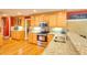 Kitchen with wood cabinets, stainless appliances, granite countertops, and a breakfast bar at 781 Templeton Dr, Loganville, GA 30052