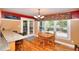 View of kitchen breakfast bar and breakfast nook with access to screened in porch at 781 Templeton Dr, Loganville, GA 30052