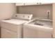 Bright laundry room with modern washer and dryer at 781 Templeton Dr, Loganville, GA 30052