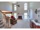 Bright living room with high ceilings, fireplace, and large windows at 781 Templeton Dr, Loganville, GA 30052