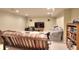 Cozy living room with couches, a chair and a bookcase at 781 Templeton Dr, Loganville, GA 30052