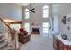 Inviting living room with high ceilings, fireplace, and staircase provides an open and airy feel at 781 Templeton Dr, Loganville, GA 30052