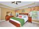 Spacious bedroom with tray ceilings and ample natural light at 781 Templeton Dr, Loganville, GA 30052