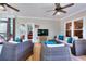 Relaxing screened patio with ceiling fans and cozy seating at 781 Templeton Dr, Loganville, GA 30052