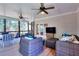 Screened porch with ceiling fans and wicker furniture at 781 Templeton Dr, Loganville, GA 30052