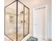 Luxurious shower with custom tile work, a built-in seat, and sleek glass enclosure at 781 Templeton Dr, Loganville, GA 30052