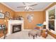 Sitting room featuring a fireplace and large window at 781 Templeton Dr, Loganville, GA 30052