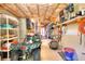 Versatile storage room with an ATV, shelves, a ladder, and a lawnmower, providing ample space for equipment at 781 Templeton Dr, Loganville, GA 30052