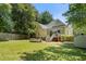 Spacious backyard with a trampoline and a view of the home's rear exterior at 161 N Barton St, Norcross, GA 30071