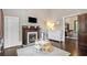 Bedroom features a fireplace, white dresser, and entry into the living room at 161 N Barton St, Norcross, GA 30071