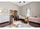Spacious bedroom showcases two beds and an open doorway to the living room at 161 N Barton St, Norcross, GA 30071