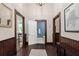 Hallway features hardwood floors, access to the bathroom, and a framed map at 161 N Barton St, Norcross, GA 30071