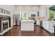 Elegant kitchen with stainless steel appliances, an island, and white cabinets at 161 N Barton St, Norcross, GA 30071