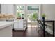 Bright kitchen has an island, bar seating, and stainless steel appliances at 161 N Barton St, Norcross, GA 30071
