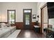 Cozy living room features dark wood floors, comfortable seating, and a front door with decorative glass at 161 N Barton St, Norcross, GA 30071
